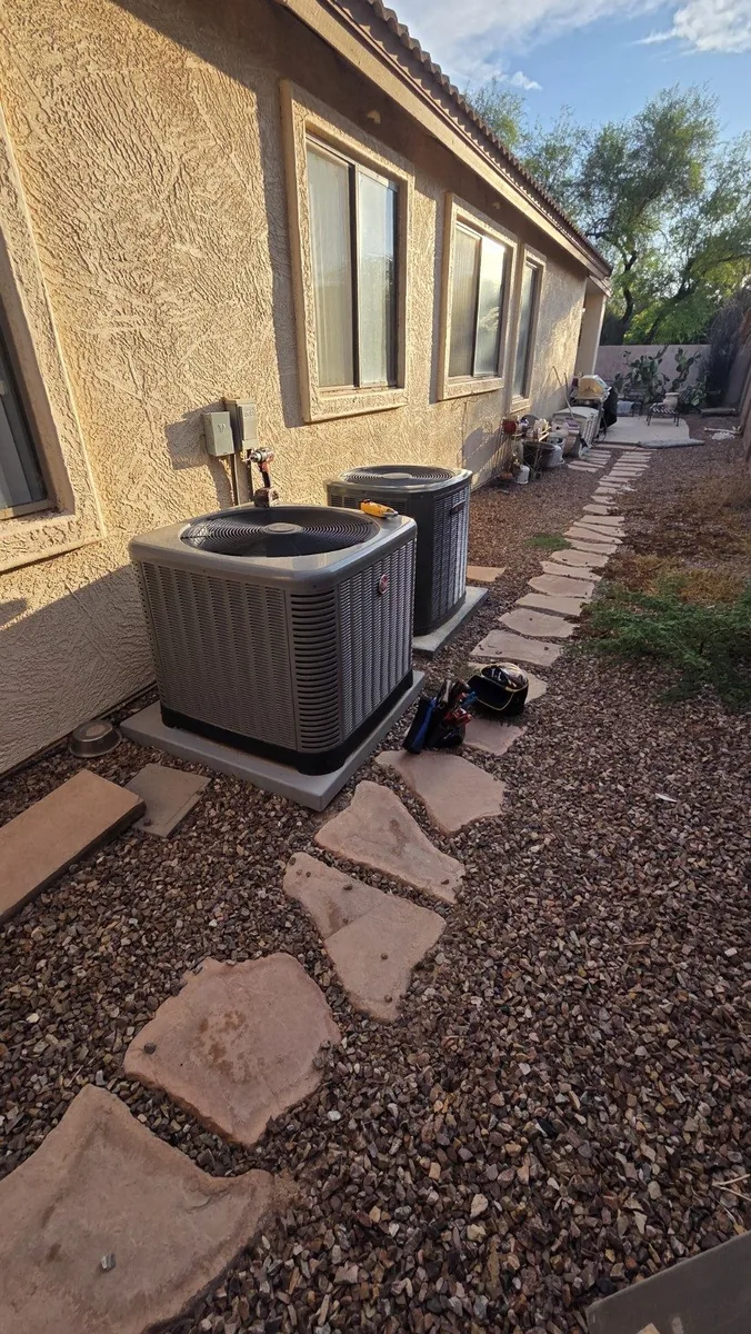 Two residential outdoor air conditioning condensers at an Arizona home